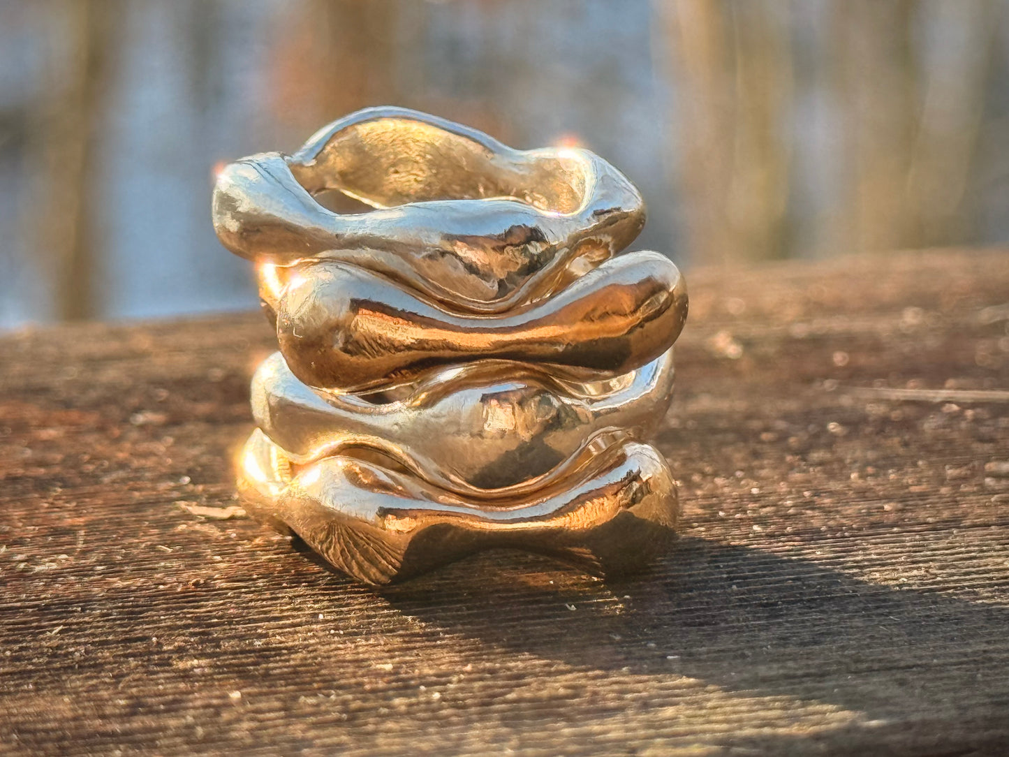stack of silver and bronze hand sculpted helix rings made in Connecticut